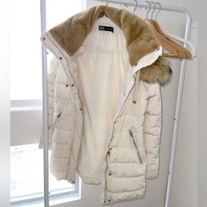 A cream Zara water repellent puffer jacket